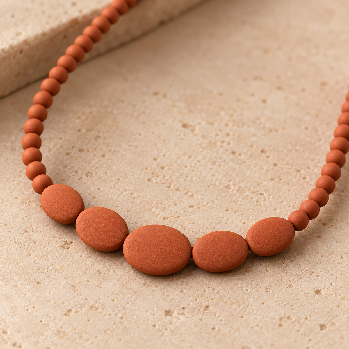 Terracotta-Colored Bead Necklace with Graduated Oval Center