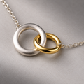 Two-Tone Orbit Necklace with Interlocked Unequal Rings